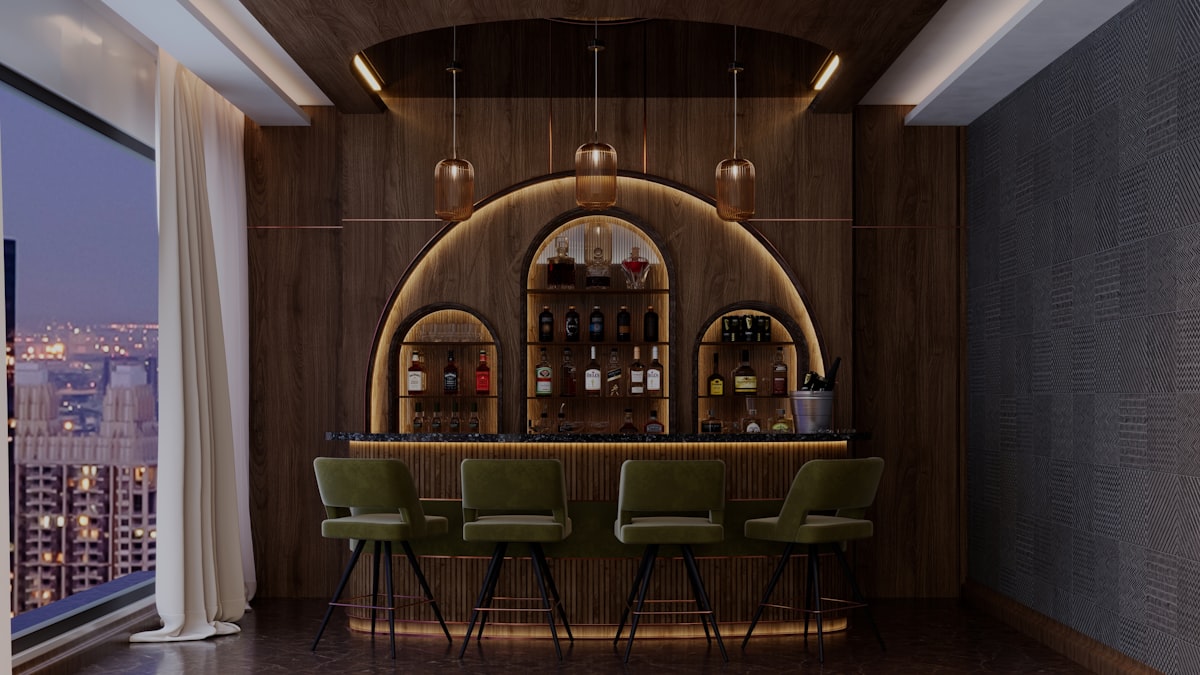 360° Bar (The Penz Hotel) – Elegant home bar with illuminated bottles and city skyline