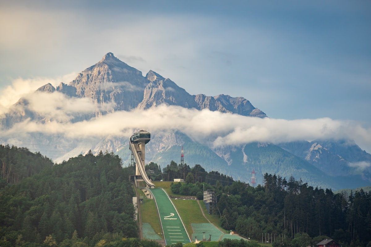 Bergisel-Schanze – Ski jumping hill with mountains and clouds in background